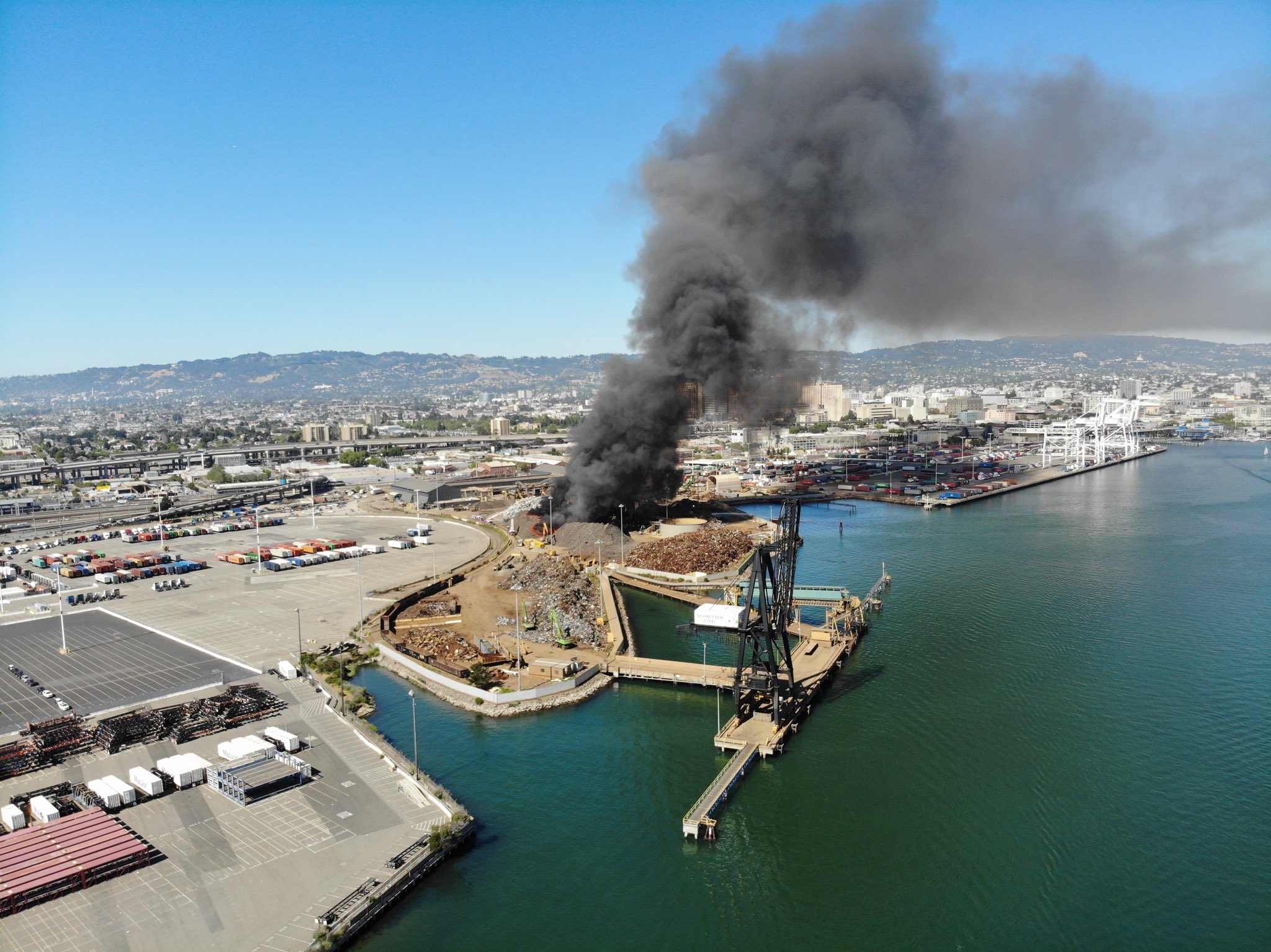Fire at Oakland recycling plant sends black plume into sky