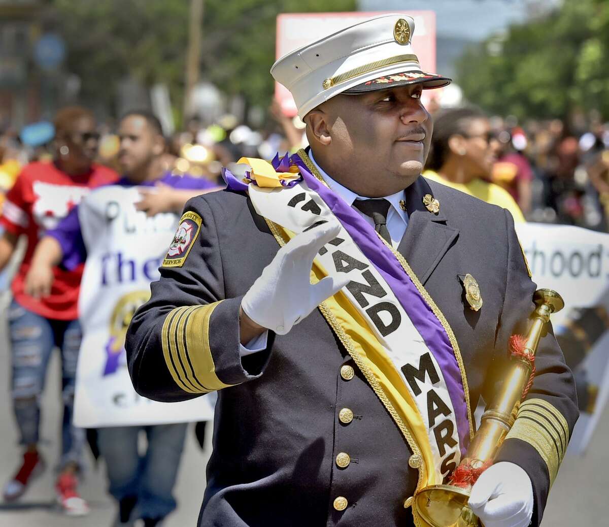 New Haven, Connecticut - June 3, 2018: New Haven Fire Chief John Alston marches as the Grand Marshall in The Freddie Fixer parade Sunday afternoon on Dixwell Ave. in New Haven.