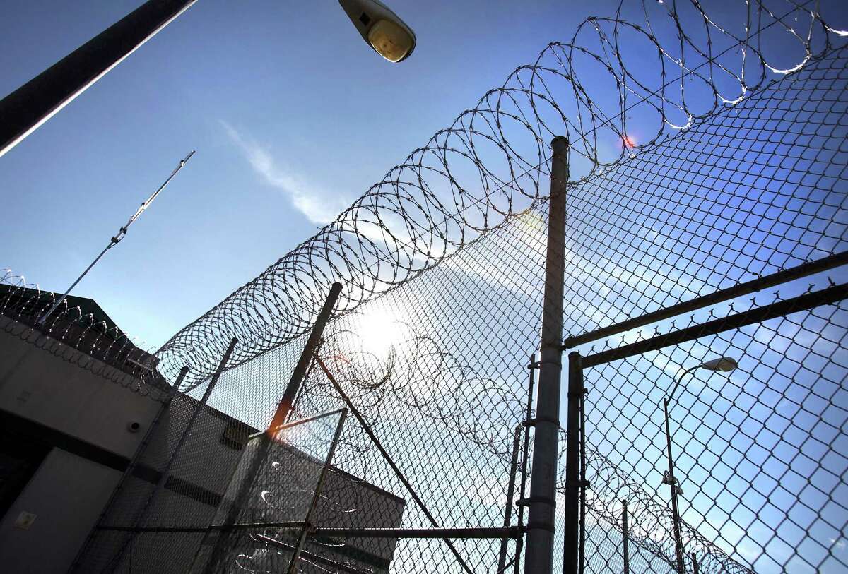 Razor wire fencing surrounds the Polunsky Unit in Livingston north of Huntsville in this file photo from 2012.