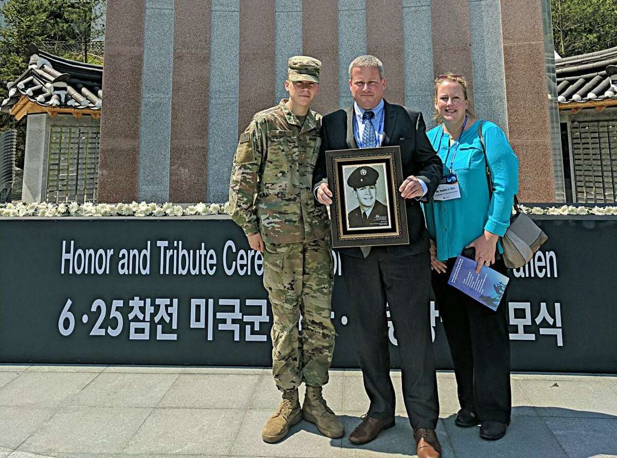 Brendan Rea Jr. of Durham, left, traveled to Korea recently with his sister Heather Rea on the invitation of the government of Korea and minister of Patriots and Veterans Affairs. At center is the Korean Ambassador for peace medals. Second Lt. Sarah Casey, right, is stationed at Camp Casey in Korea. She also received the award.