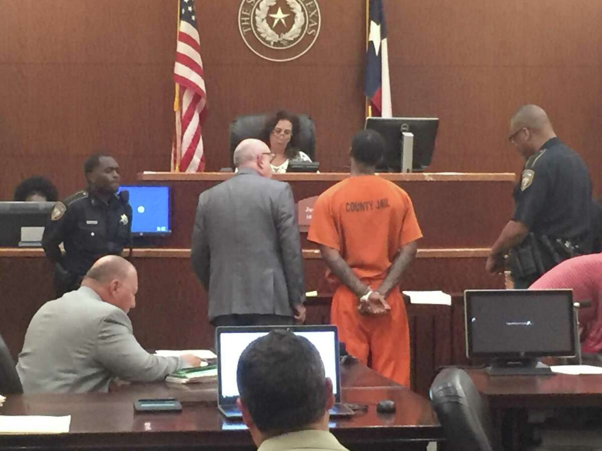 A defendant appears before a Harris County judge in Houston.