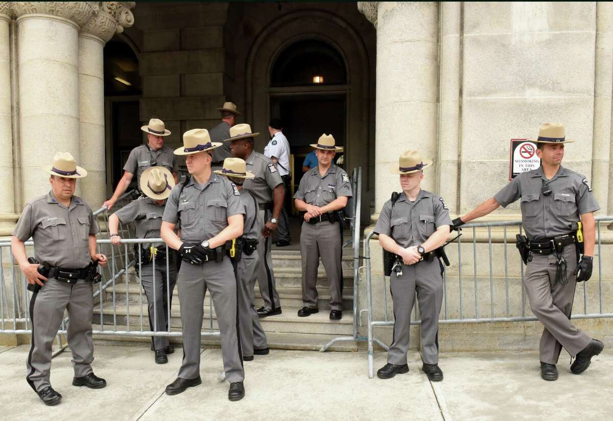New York State Troopers wait outside the Capitol for expected protestors on Monday, June 4, 2018 in Albany, N.Y. Participants in New York Poor PeopleOs Campaign: A National Call for Moral Revival were demanding immediate action to ensure all New Yorkers have access to healthcare and clean drinking water in a protest across the street at Layfayette Park. (Lori Van Buren/Times Union)