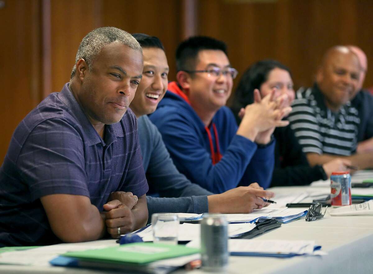 Community engagement officer Raphael Rockwell (left) listens to a speaker during a class in providing tactics for deescalating interactions and avoiding the use of force with youth at the San Francisco Scottish Rite Masonic Center on Thursday, May 31, 2018 in San Francisco, Calif. San Francisco Police Department officers attend a four day Policing the Teen Brain train-the-trainer session.