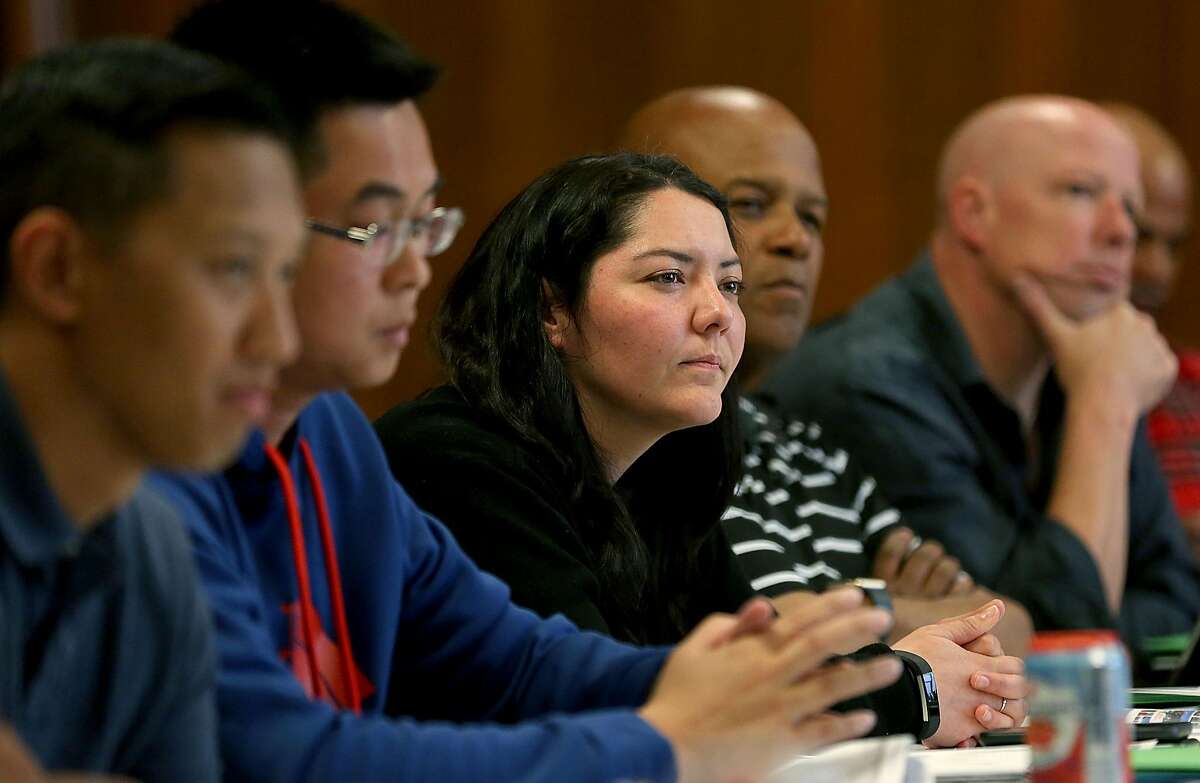 Field operation bureau officer Lili Gamero (middle) listens to a speaker during a class in providing tactics for deescalating interactions and avoiding the use of force with youth at the San Francisco Scottish Rite Masonic Center on Thursday, May 31, 2018 in San Francisco, Calif. San Francisco Police Department officers attend a four day Policing the Teen Brain train-the-trainer session.