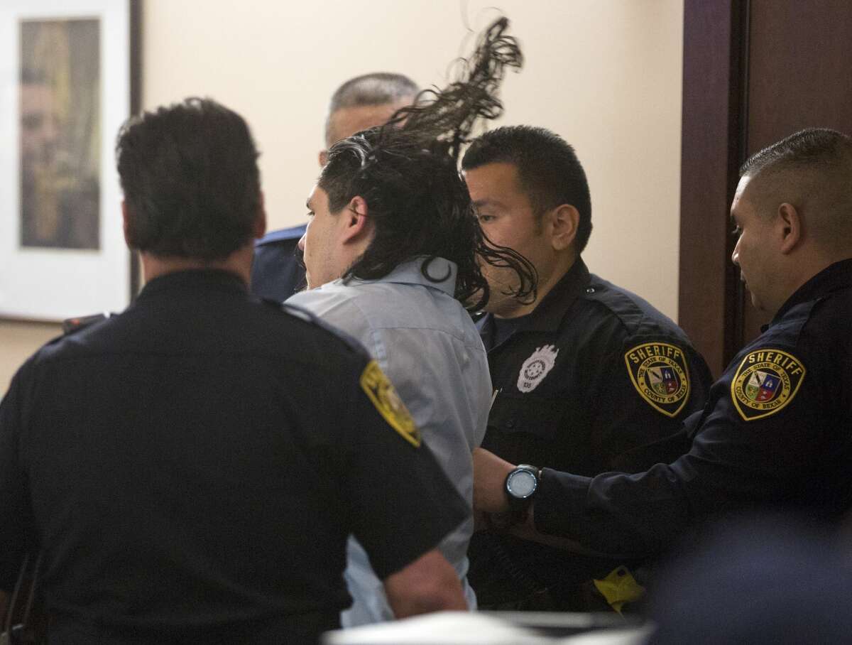 Daniel Moreno Lopez struggles Tuesday, June 05, 2018 with deputies moments after being convicted of murder at the Bexar County Justice Center in the killing in 2014 of Jose Luis Menchaca who was beaten, suffocated, dismembered and his body parts grilled on a barbecue pit.