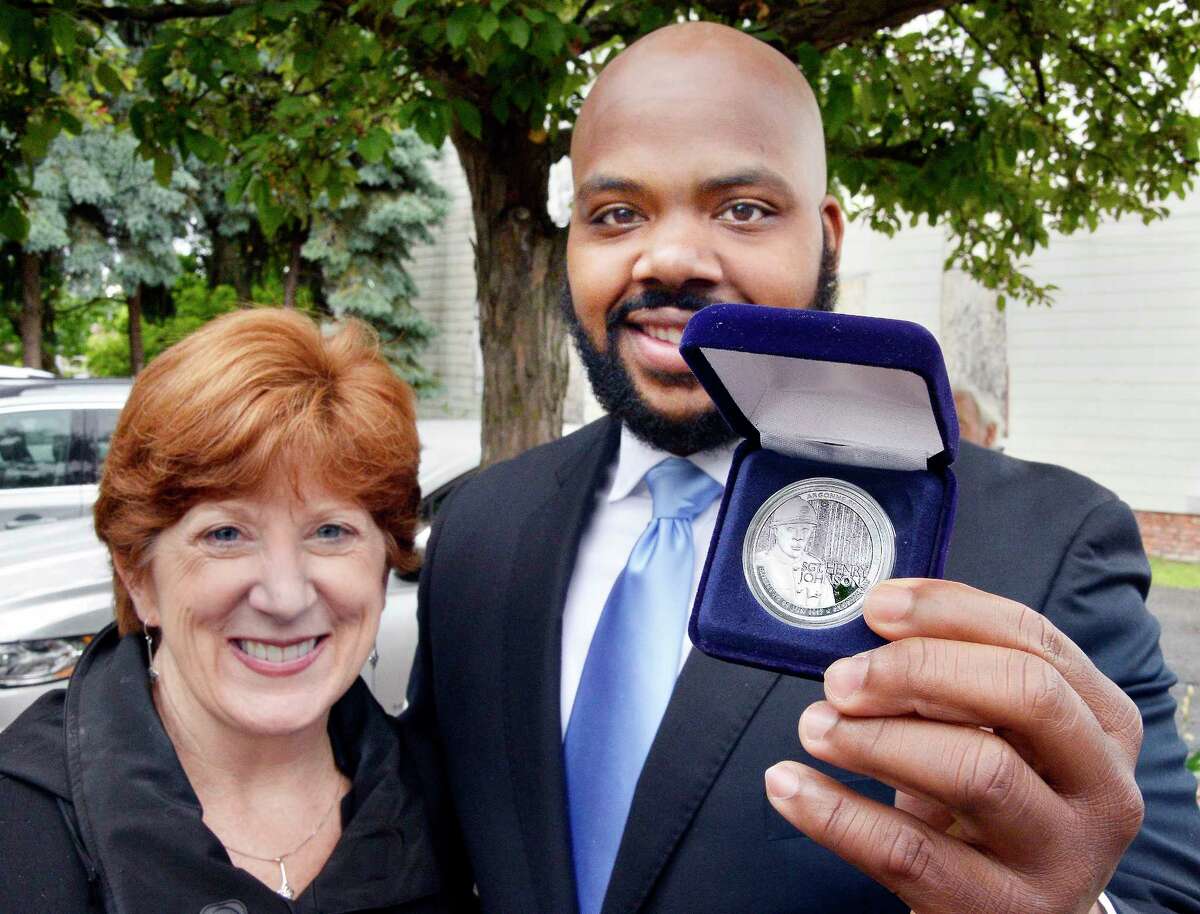 Jahkeen Hoke, right, of 4th Family Inc. poses with Mayor Kathy Sheehan and his Henry Johnson Award for Distinguished Community Service during the 2nd Annual Henry Johnson Day observance Tuesday June 5, 2018 in Albany, NY. (John Carl D'Annibale/Times Union)
