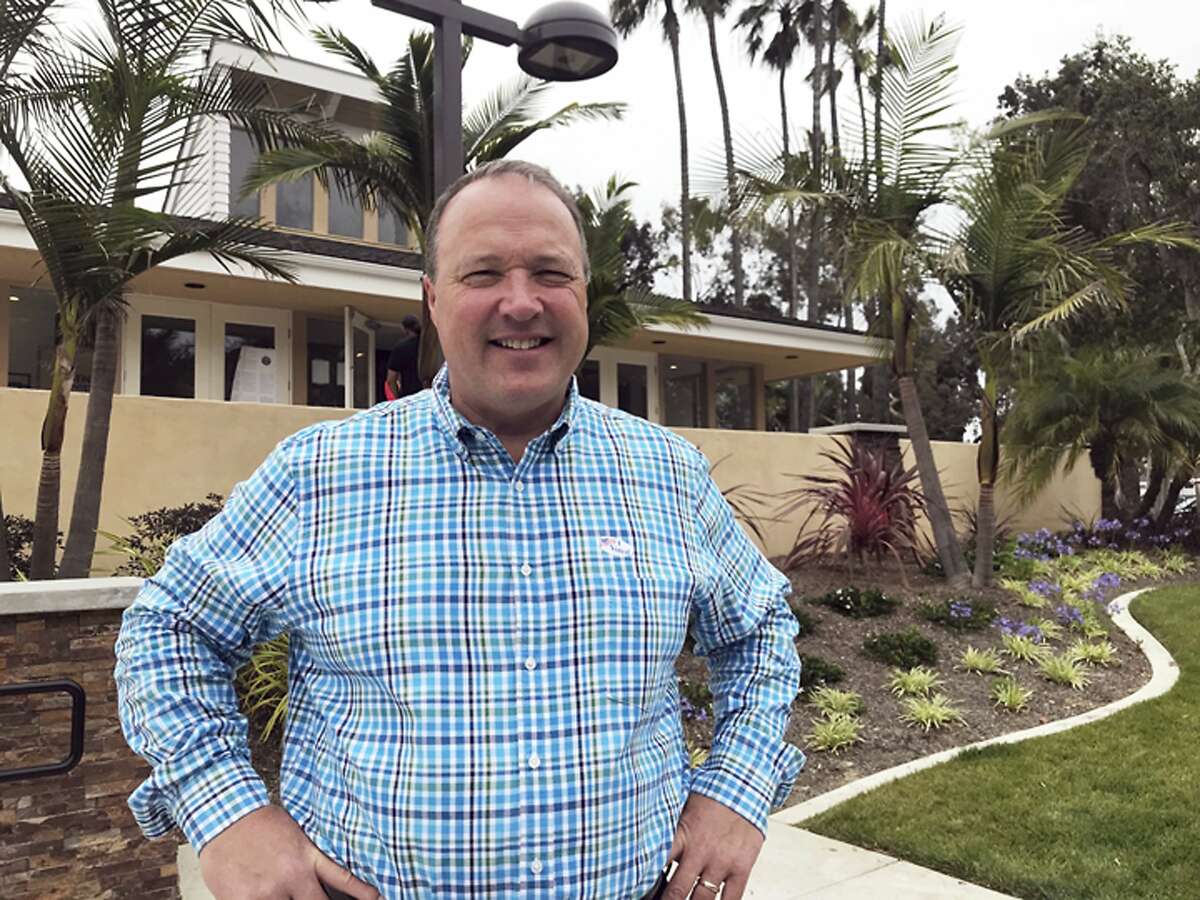 Scott Baugh, a Republican candidate for Congress from Orange County's 48th District, poses outside a polling place after voting in Huntington Beach, Calif., Tuesday, June 5, 2018. (AP Photo/Krysta Fauria)