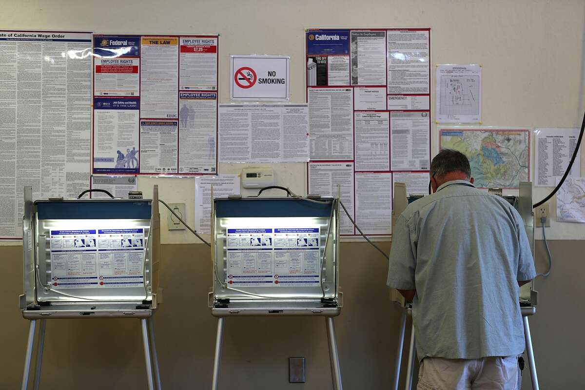In this file photo, a voter fills out a ballot inside a polling station at a Ross Valley fire station on June 5, 2018.
