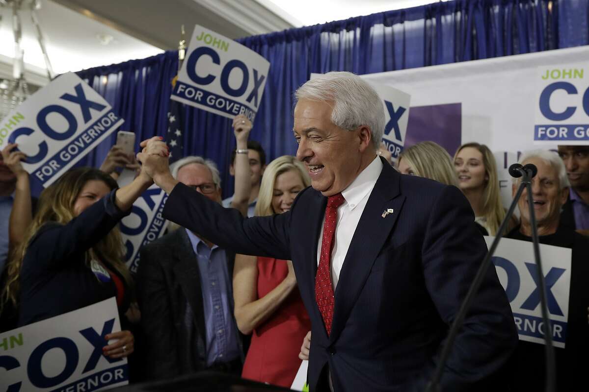 Republican gubernatorial candidate John Cox greets a supporter during a Republican election party Tuesday, June 5, 2018, in San Diego. (AP Photo/Gregory Bull)