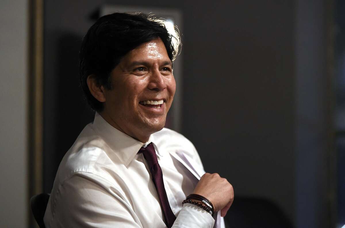 Kevin de Leon, California state Senate president pro tem and Democratic candidate for the U.S. Senate, laughs as he talks to his staff before speaking at an election party Tuesday, June 5, 2018, in Los Angeles. (AP Photo/Mark J. Terrill)