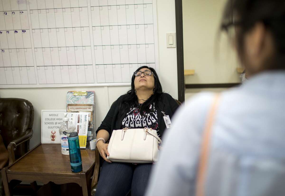 Diana Del Pilar rests for under a minute before leaving, after a Saturday class day designed to help students make up work and attendance.