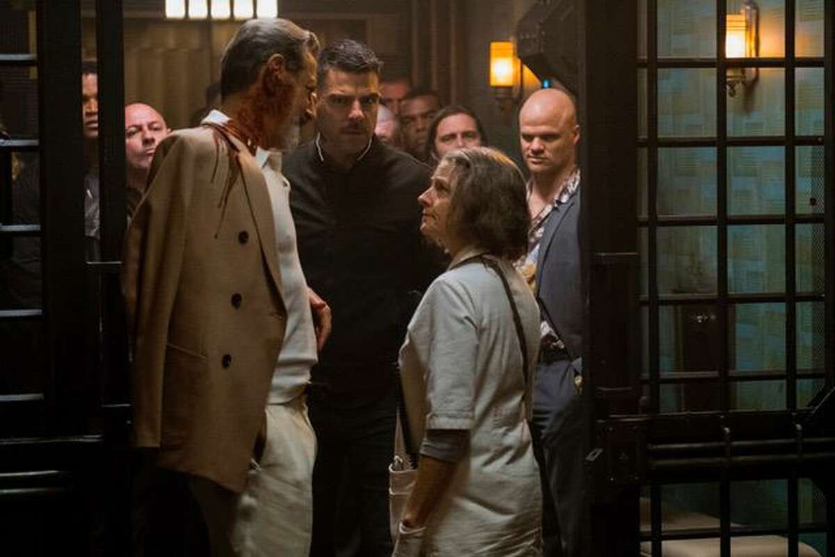 Jeff Goldblum (left) and Zachary Quinto consult with Jodie Foster, playing a nurse who runs a hospital that specializes in discreetly treating injured criminals, in “Hotel Artemis.”