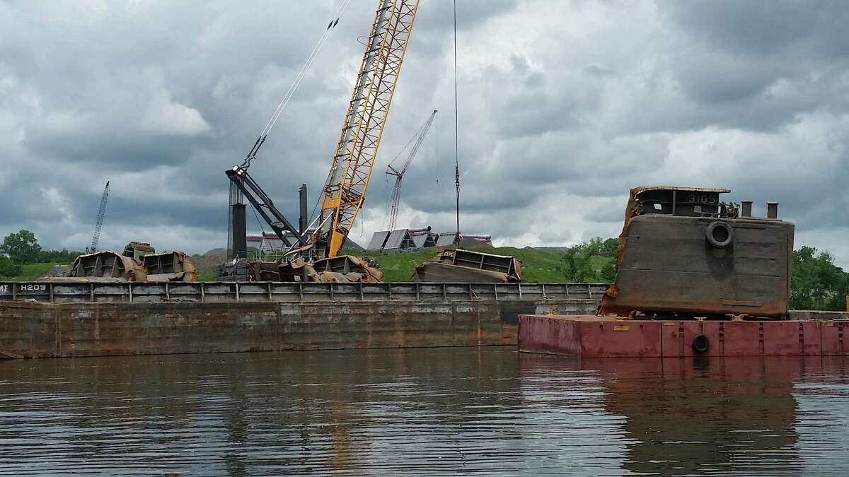 Crews lift up portions of a sunken barge from the bottom of the Hudson River at the Port of Coeymans on June 6, 2018. (John Lipscomb/River Keeper)