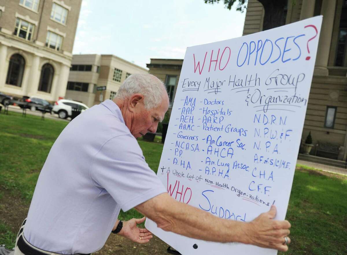 As a member of Indivisible Greenwich, Sandy Litvack, an posted a sign protesting the proposed American Health Care Act outside the Senior Center in downtown Greenwich. Litvack is now a Democratic selectman.