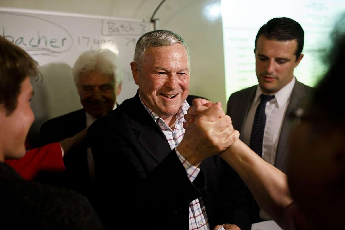 Dana Rohrabacher, Republican U.S. Senate candidate from California, shakes hands with an attendee at a primary election watch party in Costa Mesa, California, U.S., on Tuesday, June 5, 2018. California's jungle primary is living up to its name in Orange County, where a former protege of 15-term Rohrabacher is among the names on a crowded June 5 ballot. Photographer: Patrick T. Fallon/Bloomberg