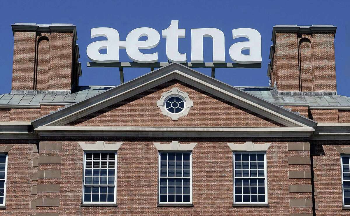 A sign stands at Aetna headquarters in Hartford. Aetna is about to fall under the corporate control of Woonsocket, R.I.-based CVS Health, which means Connecticut will lose Aetna as a Fortune 500 company.
