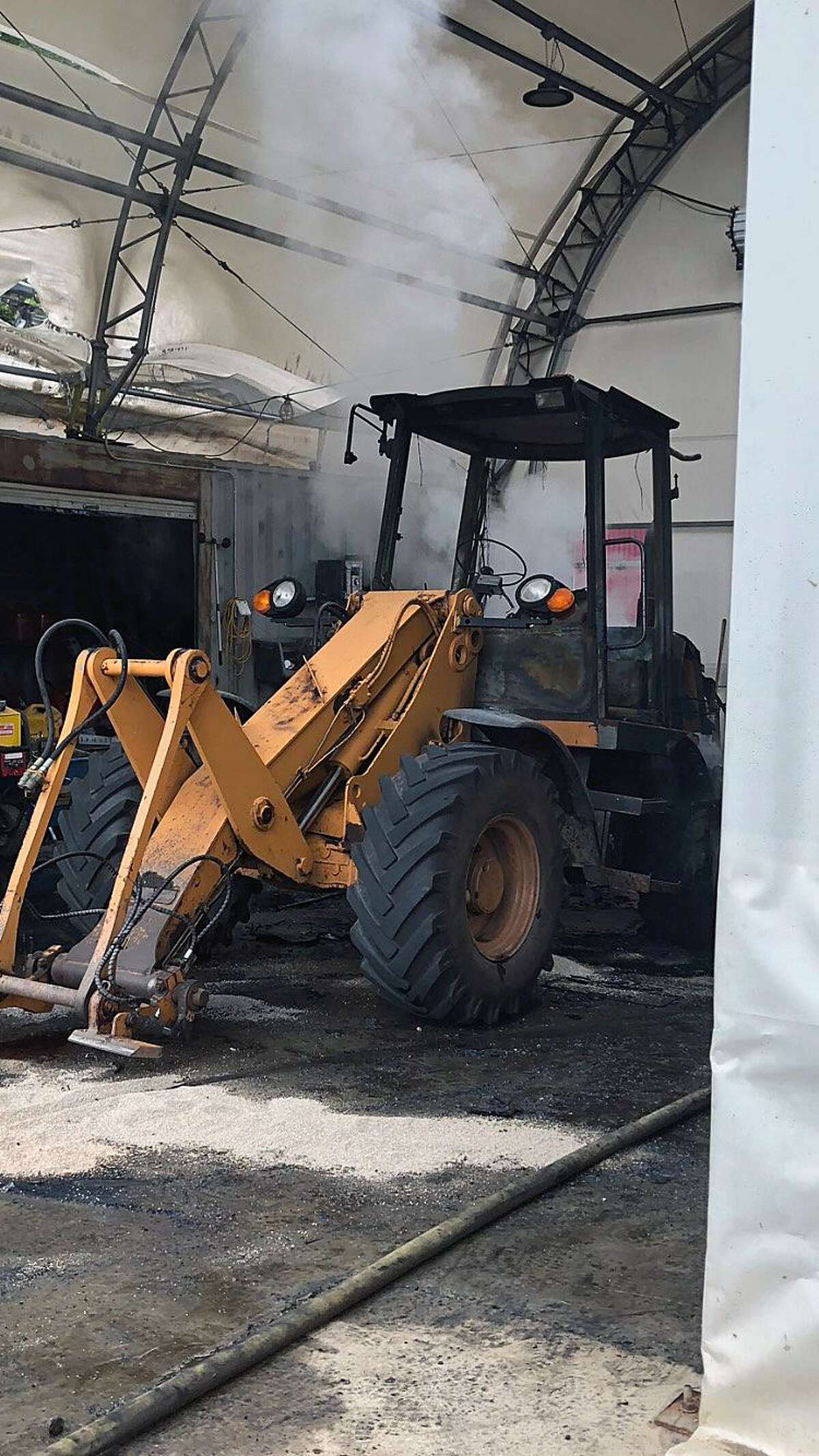 Fire units from the Monroe, Stepney and Stevenson fire departments responded to 189 Monroe Turnpike in Monroe, Conn., on June 6, 2018, for a front loader tractor on fire in the garage, Fire Marshal William Davin said.