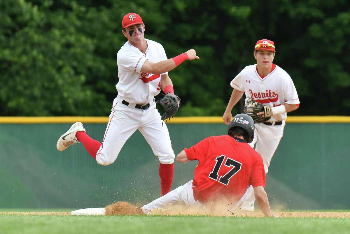 Fairfield Prep’s Will Lucas attempts to turn a double play during the Class LL semifinals against the Cheshire on Wednesday at Municipal Stadium in Waterbury.