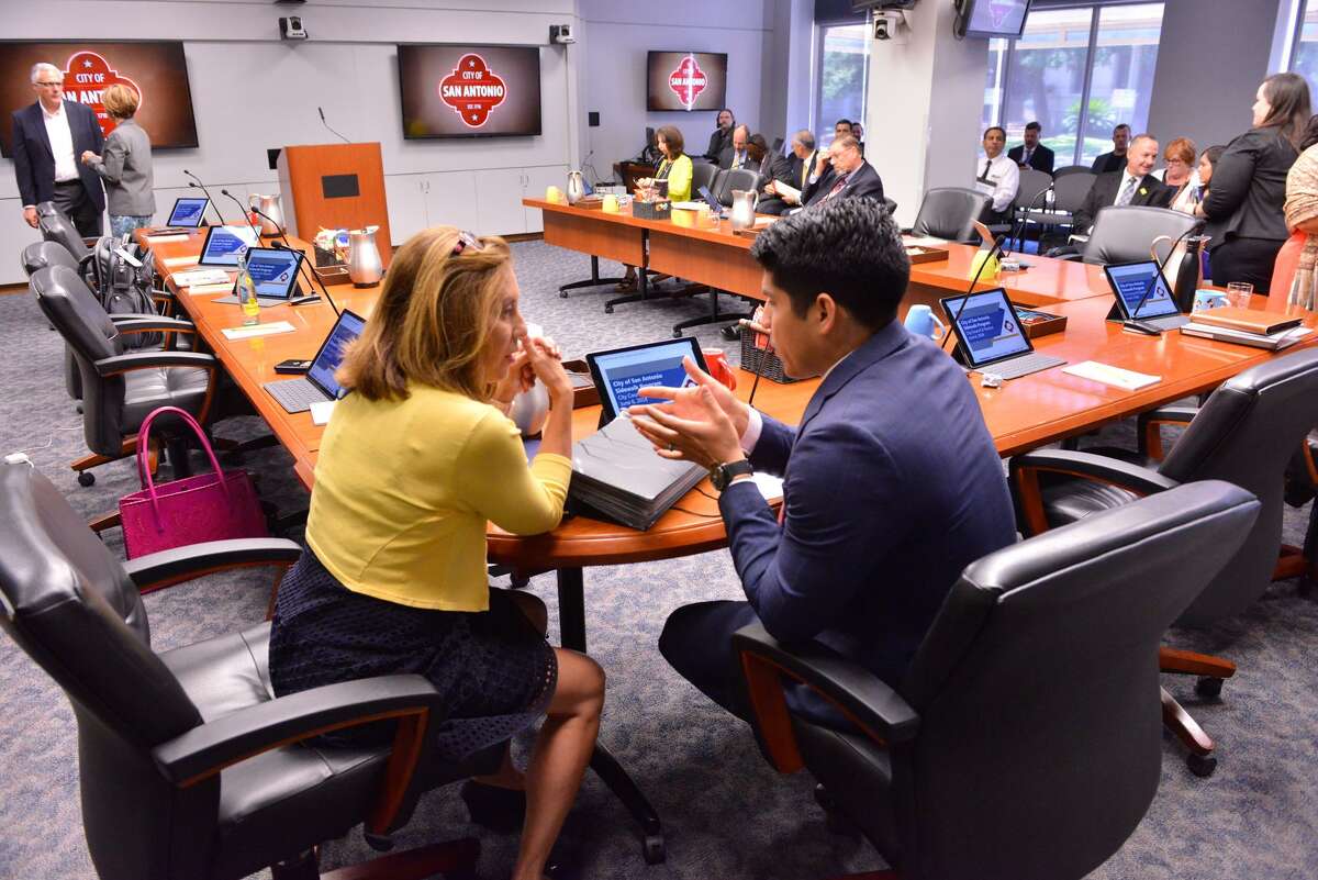City Council members Shirley Gonzales and Rey Saldana talk prior to a discussion on the council consideration of "Innovation Zones" during a Wednesday meeting at.