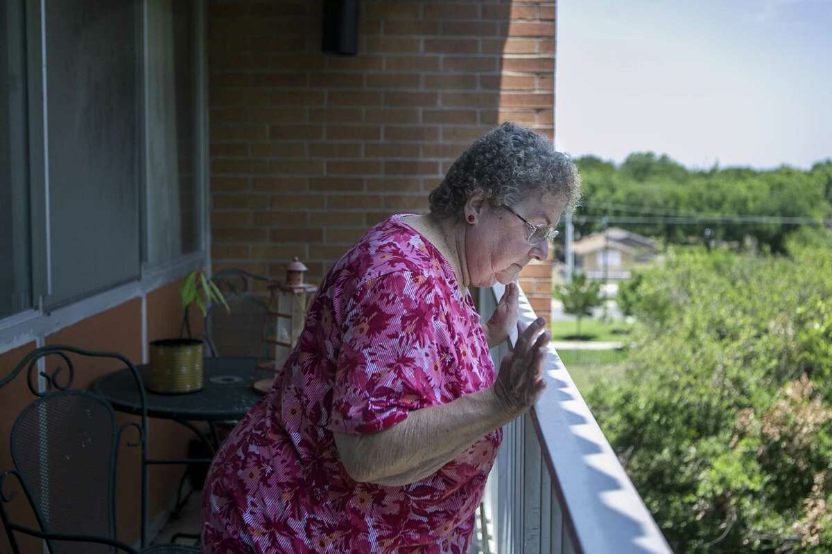 Sharon Samples, 69, checks out the view from her fifth-floor patio at Laurel Plaza Apartments in New Braunfels. Samples has lived at the complex for more than eight years and is concerned how U.S. Housing and Urban Development Secretary Ben Carson’s proposed rent reforms may affect her and her neighbors.