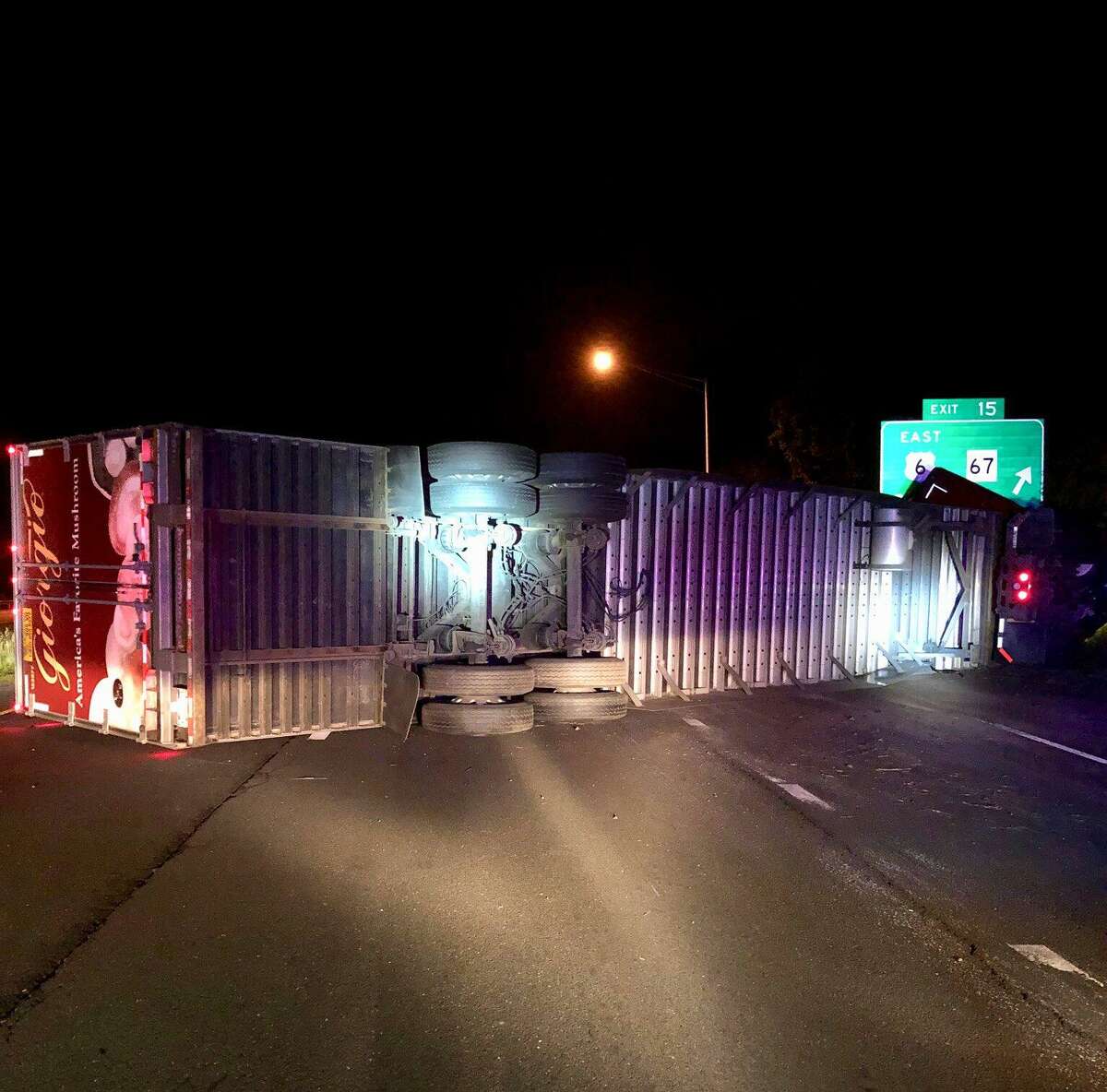 A tractor-trailer truck carrying mushrooms tolled over on eastbound I-84 in Southbury on Thursday, June 7, 2018. The accident, reported at 3:05 a.m., closed all eastbound lanes between Exits 14 and 15.