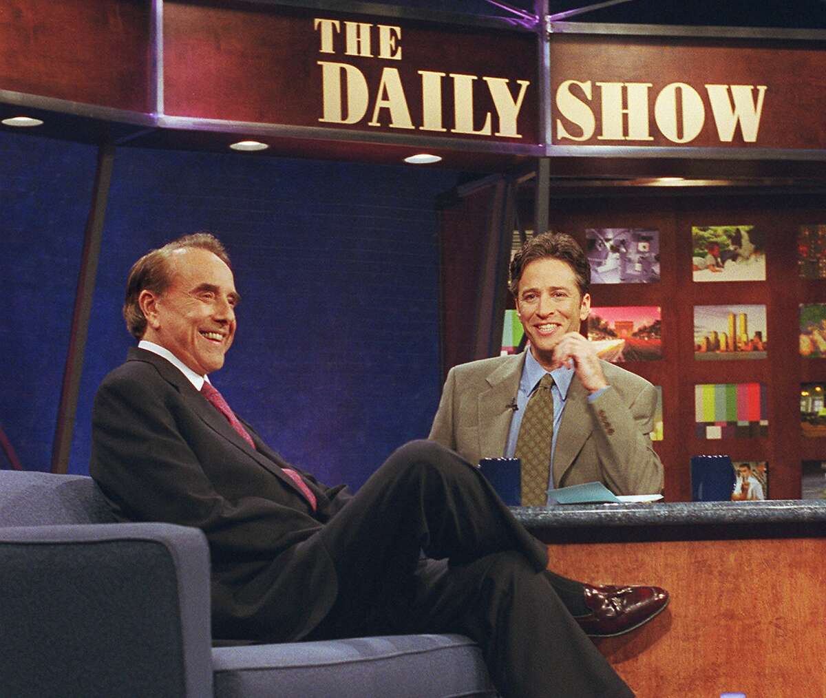 ** FILE **Jon Stewart, host of "The Daily Show," interviews Sen. Bob Dole on the set of the comedy show in New York, in this Dec. 7, 1999, file photo. CNN has signed Stewart of Comedy Central to make a weekly version of his satirical news program to air late at night. (AP Photo/Comedy Central, Al Levine/FILE)