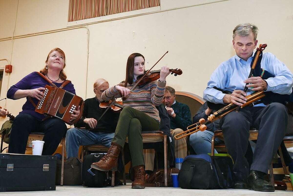 Button accordionist Loretta Egan Murphy, violinist Lindsey Ceitin and master uilleann piper Jerry O'Sullivan play during a session of Irish traditional music for the P.V. O'Donnell branch of the Comhaltas Ceoltóirí Éireann earlier this year. Another session is planned on June 21 at St. Gabriel's Parish Hall in Milford.