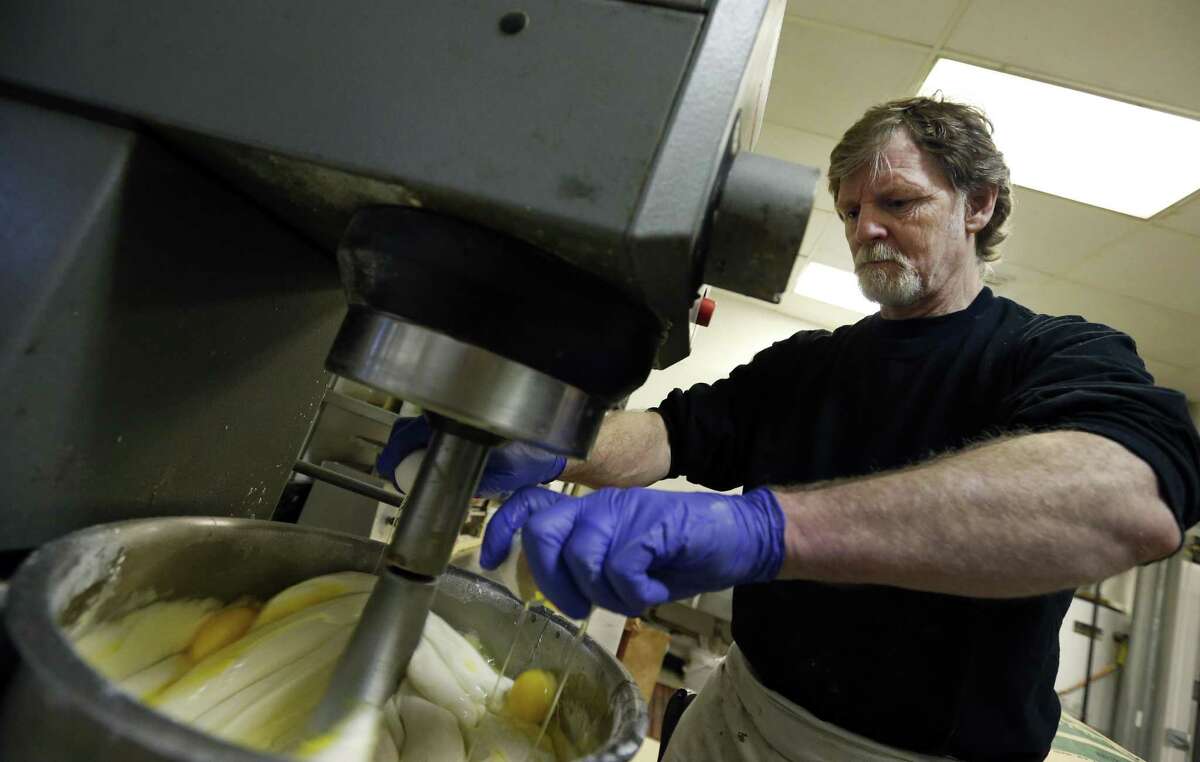 FILE - In this March 10, 2014 file photo, Masterpiece Cakeshop owner Jack Phillips cracks eggs into a cake batter mixer inside his store in Lakewood, Colo. The Supreme Court is taking on a new clash between gay rights and religion in a case about a wedding cake for a same-sex couple in Colorado. The justices said Monday, June 26, 2017, they will consider whether a baker who objects to same-sex marriage on religious grounds can refuse to make a wedding cake for a gay couple. (AP Photo/Brennan Linsley, File)