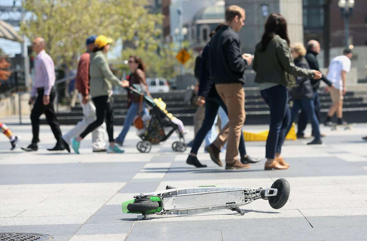 Scooter left in the plaza in front of the Ferry Building on the Embarcadero on Monday, April 30, 2018, in San Francisco, Calif.