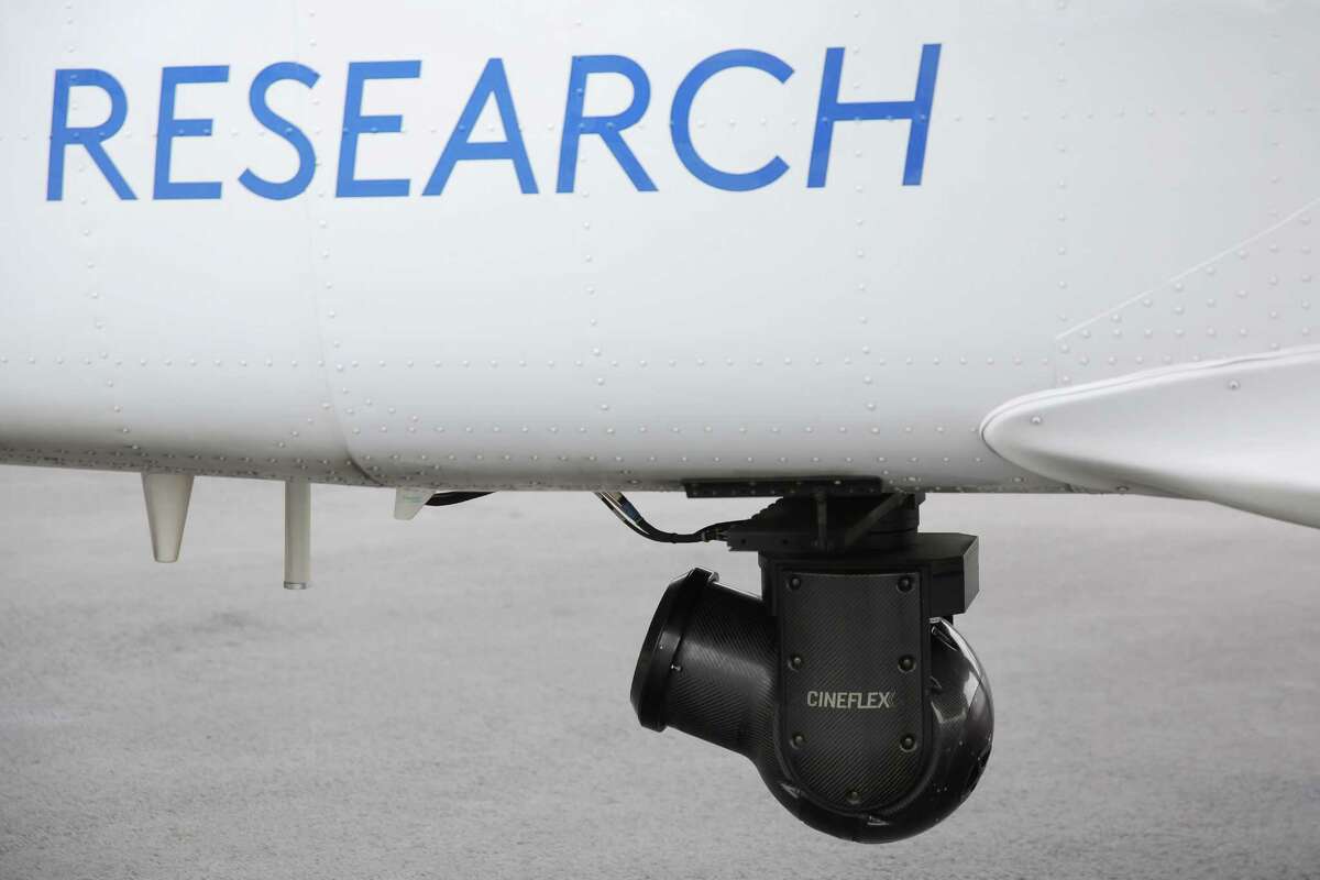 A gyro-stabilized Cineflex camera is attached to the bottom of the CoStar Group's Cessna Grand Caravan, a slow speed research plane, before taking a flight over downtown Seattle, May, 31, 2018. The crew flies to locations through out the country to gather data, video and images of real estate that will be used to determine trends in the national real estate market.