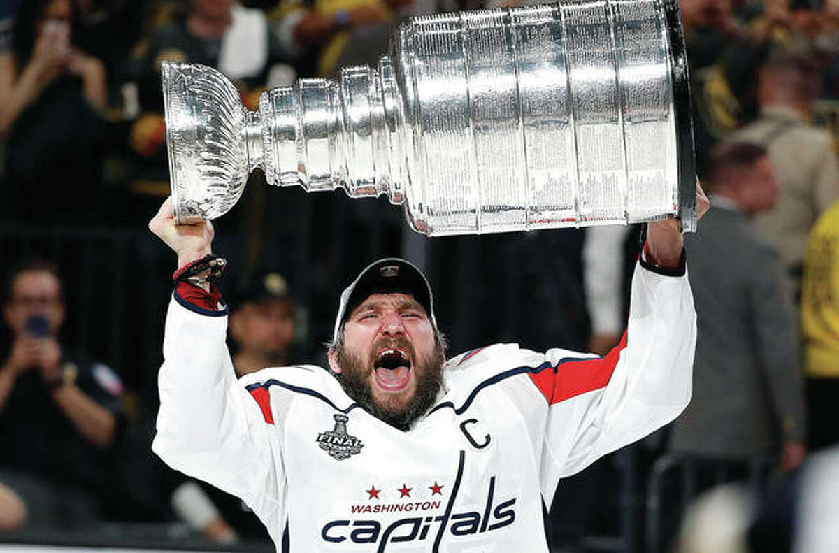 Washington Capitals left wing Alex Ovechkin hoists the Stanley Cup after the Capitals defeated the Golden Knights Thursday night in Game 5 of the Stanley Cup Finals in Las Vegas.