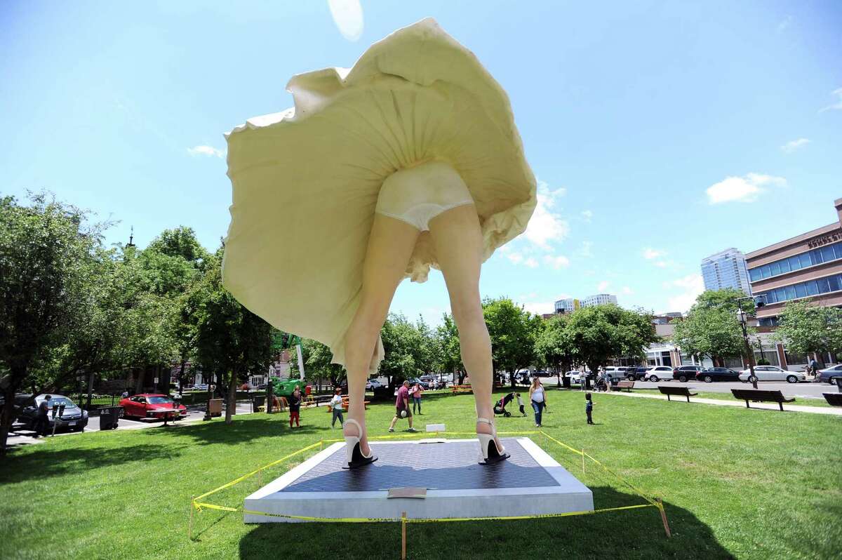 The 26-foot-tall Marilyn Monroe stands completed in Latham Park in downtown Stamford, Conn. on Wednesday, June 6, 2018. Some have complained that the statue, specifically the statue's backside facing the First Congregational Church on Walton Pl., is disrespectful.