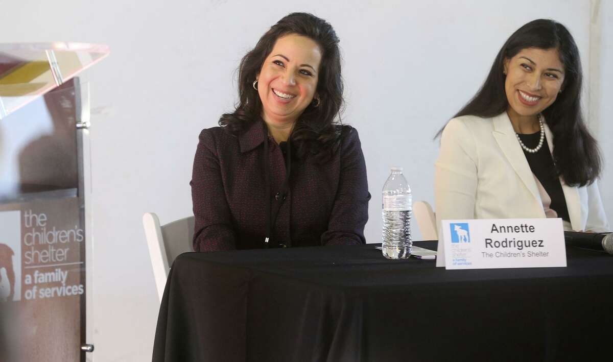 Annette Rodriguez (center), president of The Children's Shelter, listens to a speaker Wednesday March 7, 2018 during a panel discussion of the Masters Leadership Program held at The Children's Center. Rodriguez rose from administrative assistant to CEO at The Children's Shelter and was recently named vice chair of the national Alliance for Strong Families and Communities Board of Directors. Rodriguez was there to speak about the shelter's mission. To the right is Evita Morin of Rise Recovery.