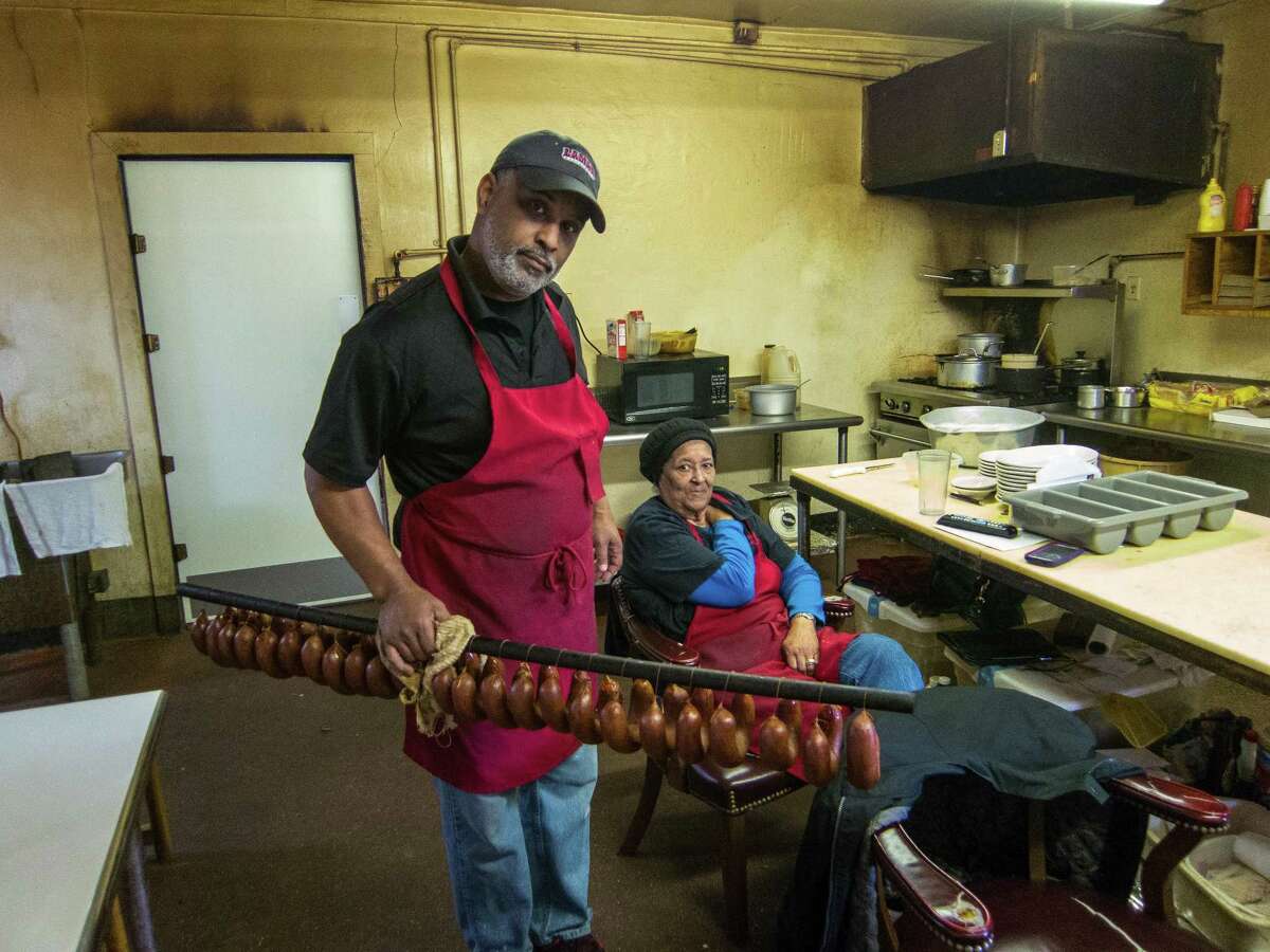 George and his mother Marie Gerard with handmade beef links at Gerard?’s Bar-B-Q