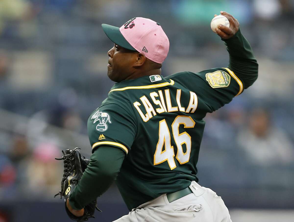 Oakland Athletics relief pitcher Santiago Casilla (46) pitches during the seventh inning of a baseball game against the New York Yankees in New York, Sunday, May 13, 2018. (AP Photo/Kathy Willens)