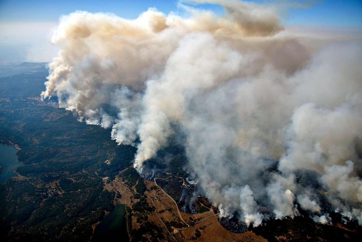 Columns of smoke rise from the Atlas Fire as it burns in the hills East of Napa, Calif., on Monday, October, 9, 2017.