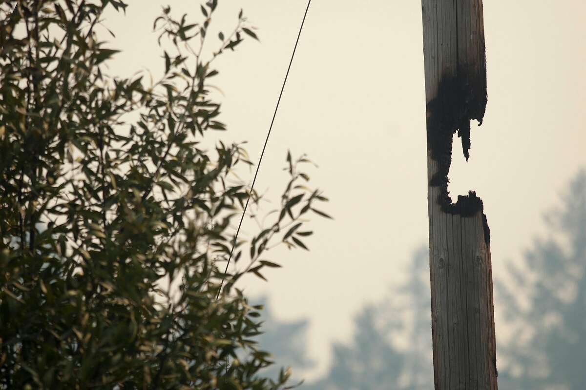 A partially burned through power pole along Lokoya raod after flames from the Nuns fire moved through the Mt Veeder area in Napa, California, USA 11 Oct 2017.