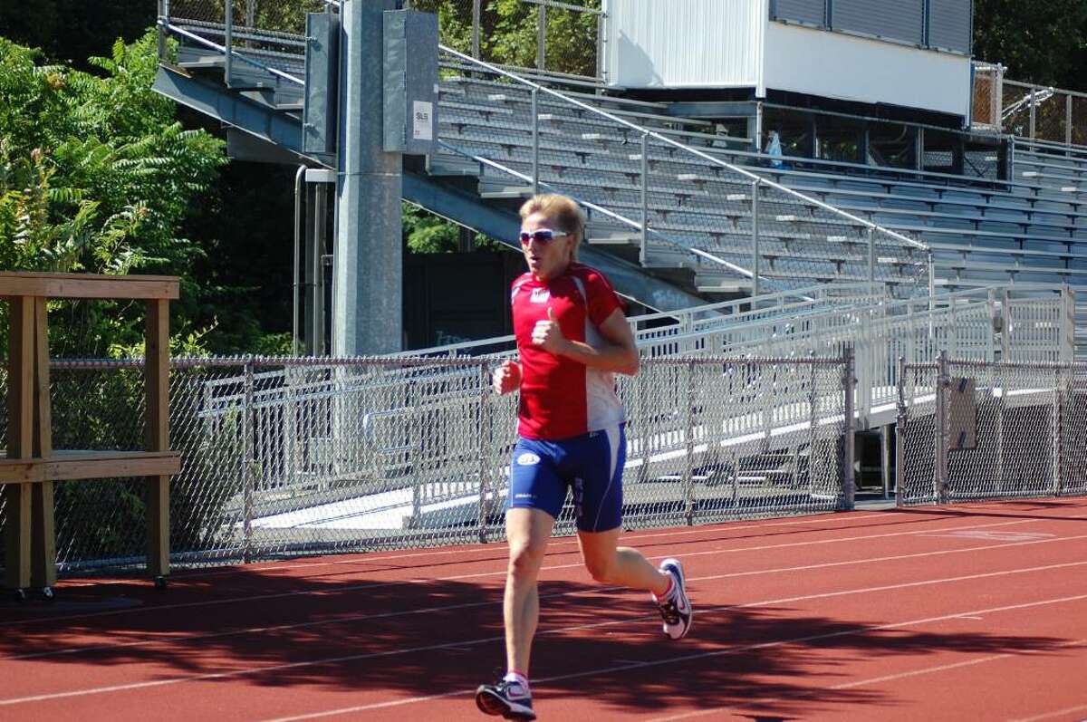 Ivan Skobrev, a two-time Olympic medal winner, runs at Brien McMahon High School in Norwalk as part of his training.