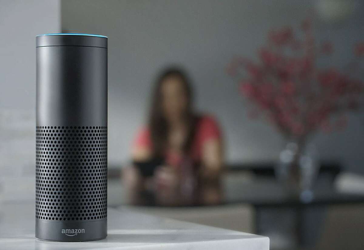 This product image provided by Amazon shows the Amazon Echo speaker. The biggest feature in Amazon’s Echo speaker is a voice-recognition system called Alexa that is designed to control Pandora, Amazon Music and Prime Music services as well as give information on news, weather and traffic. (Amazon via AP)