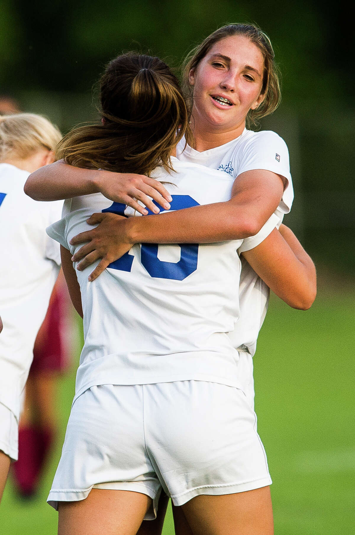 Midland players celebrate a goal during the Chemics' Division 1 regional final against Grandville on Friday, June 8, 2018 in Rockford. (Katy Kildee/kkildee@mdn.net)