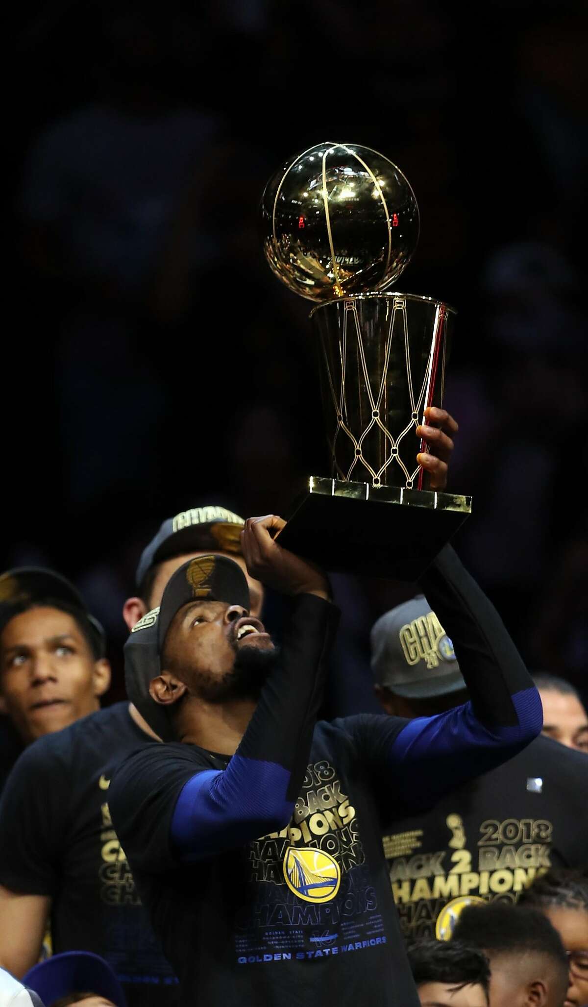 Golden State Warriors' Kevin Durant celebrates the Warriors' 3rd NBA Championship in 4 years after a 108-85 win over Cleveland Cavaliers in Game 4 of the NBA Finals at Quicken Loans Arena in Cleveland, OH on Friday, June 8, 2018.