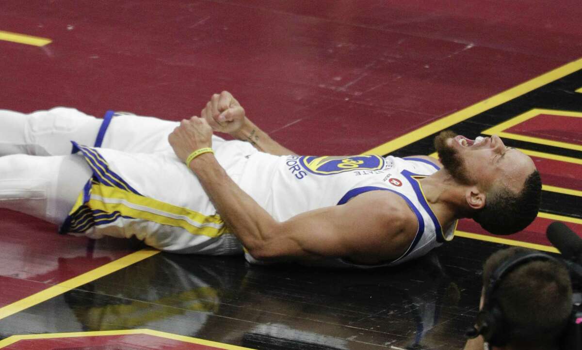 Stephen Curry gets down during the Warriors' Game 4 blowout of the Cavaliers in Cleveland.
