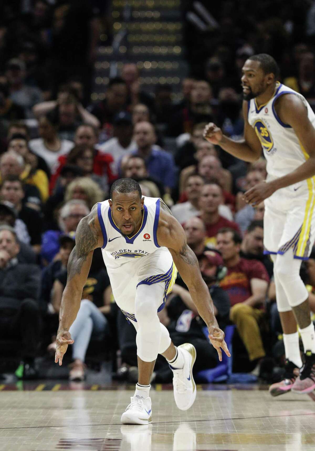 Golden State Warriors' Andre Iguodala reacts after hitting a three-pointer in the second quarter during game 4 of The NBA Finals between the Golden State Warriors and the Cleveland Cavaliers at Oracle Arena on Friday, June 8, 2018 in Cleveland, Ohio.