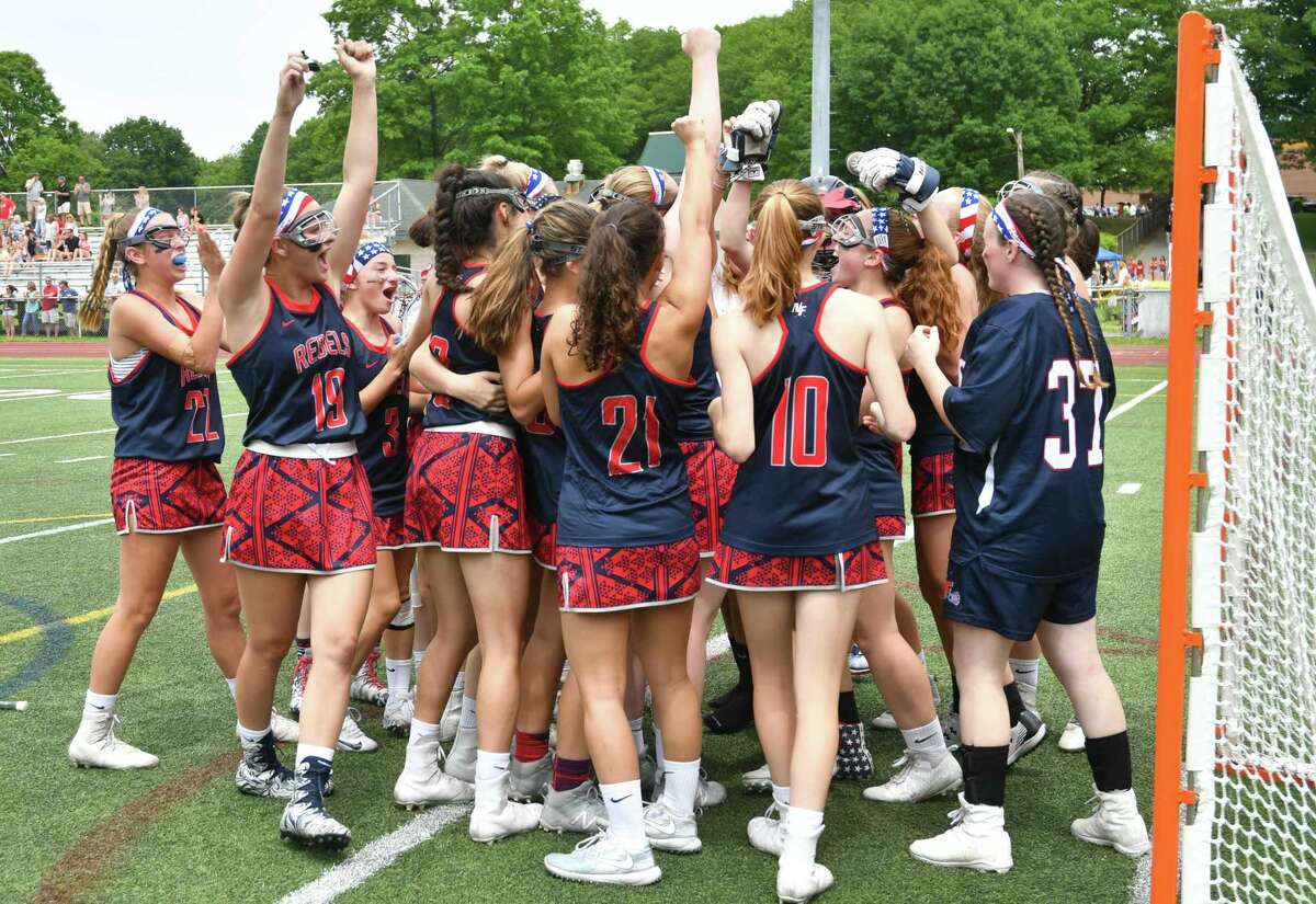 The New Fairfield Rebels celebrate a 9-6 victory over the East Catholic Eagles for the CIAC Class S Girls Lacrosse Championship on Saturday June 9, 2018, at Jonathan Law High School in Milford, Connecticut.