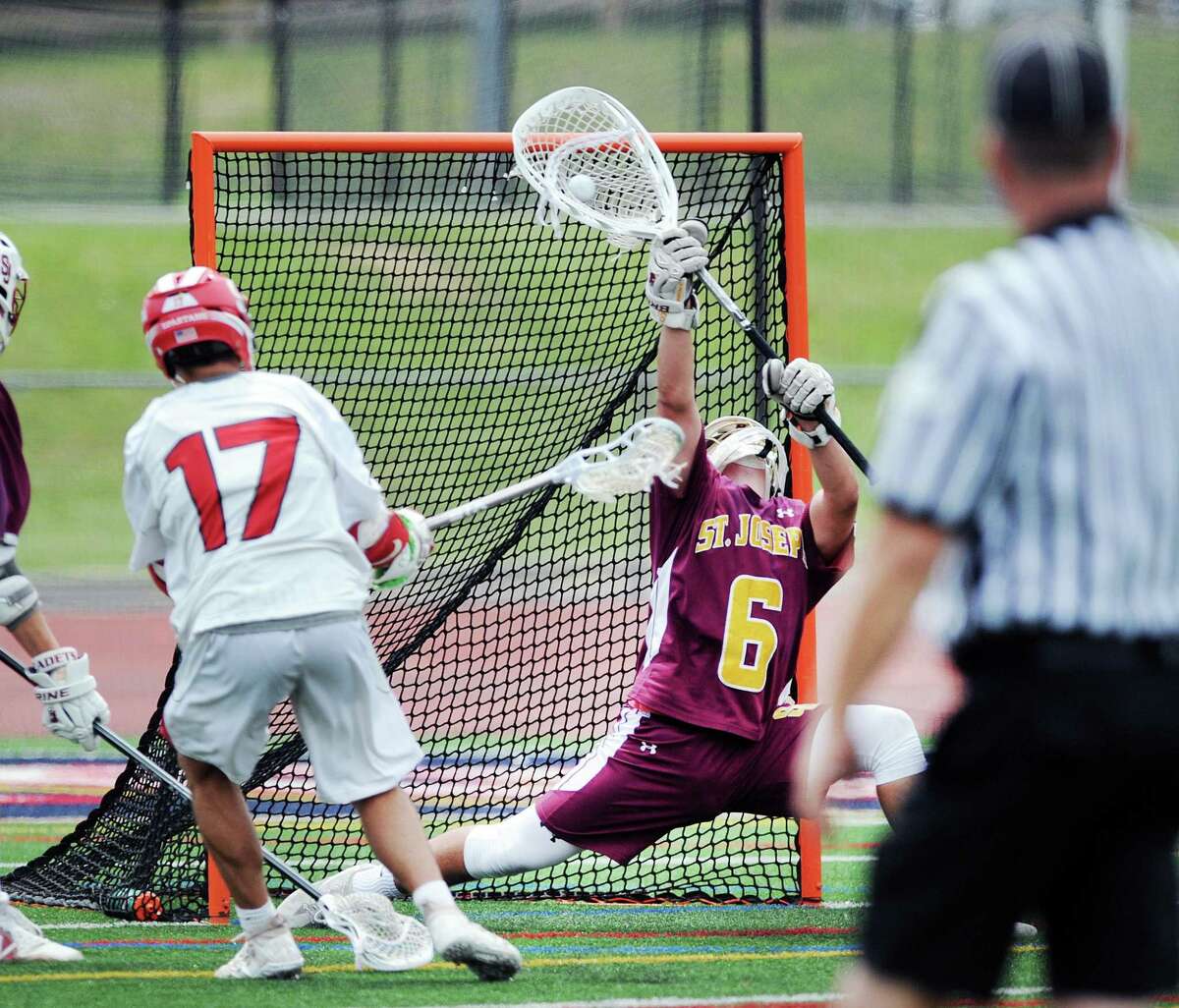 St. Joe's goalie Kyle Burbank (#6) stops a point-blank shot by Dante Giachello (#17) of Somers during the boys high school lacrosse Class S title game between St. Joseph High School and Somers High School at Brien McMahon High School in Norwalk, Conn., Saturday, June 9, 2018. St. Joe's captured the titled beating Somers 11-6, winning their 5th state title in 10 years.