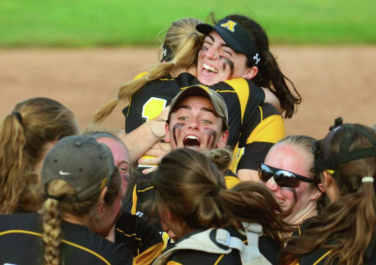 Amity celebrates its win over Trumbull in the Class title game on Saturday,