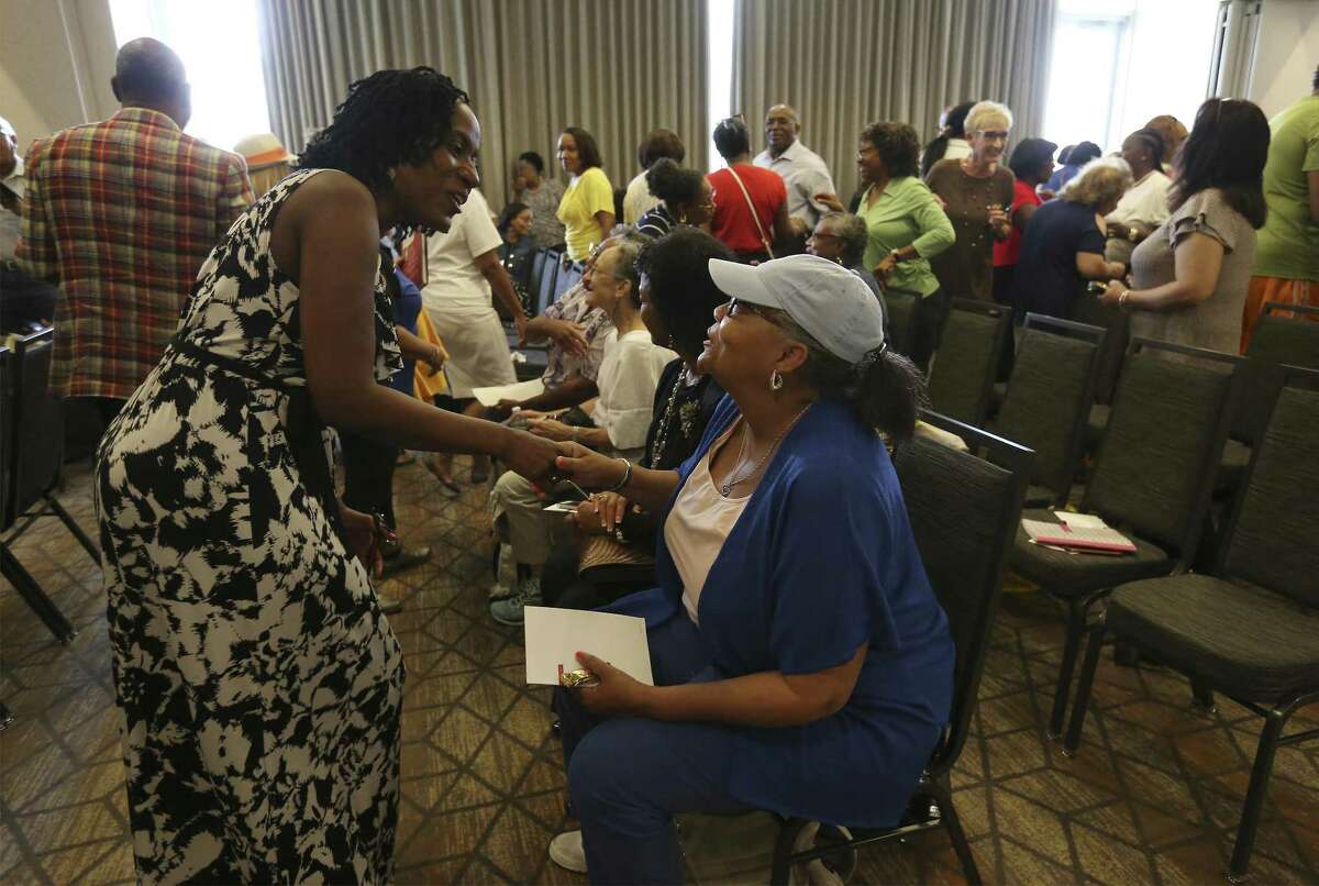 Danette Brown (seated) and Deborah Butler greet one another as local NAACP volunteers gather at the Grand Hyatt for training and orientation on Saturday, June 9, 2018 to get ready for the organization's national convention in San Antonio in July. Organizers expect 8,000 to 10,000 people will attend the five-day convention, which is in its 109th year. (Kin Man Hui/San Antonio Express-News)