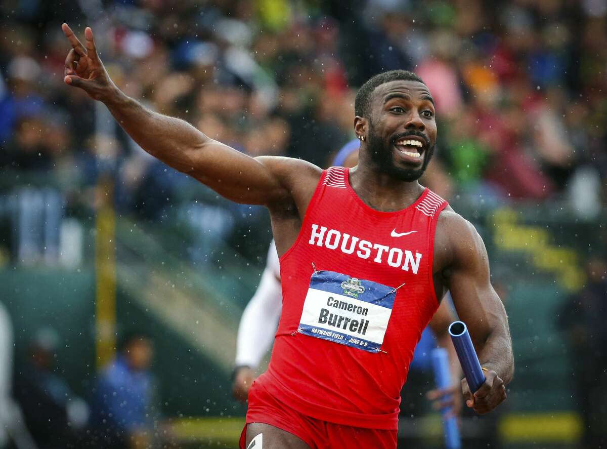 Houston's Cameron Burrell raises two fingers to indicate Houston's back-to-back men's 400-meter relay wins, during the third day of the NCAA Outdoor Track and Field Championships at Hayward Field on Friday, June 8, 2018, in Eugene, Ore. (Andy Nelson/The Register-Guard via AP)