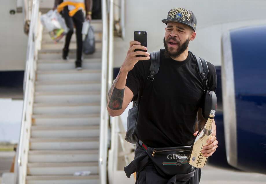   JaVale McGee, of the Golden State Warriors, arrives with his team from Cleveland, Ohio, to Landmark Aviation, Oakland, California on Saturday, June 9, 2018. after defeating the Cleveland Cavaliers in the NBA Finals. Photo: Jessica Christian / The Chronicle 