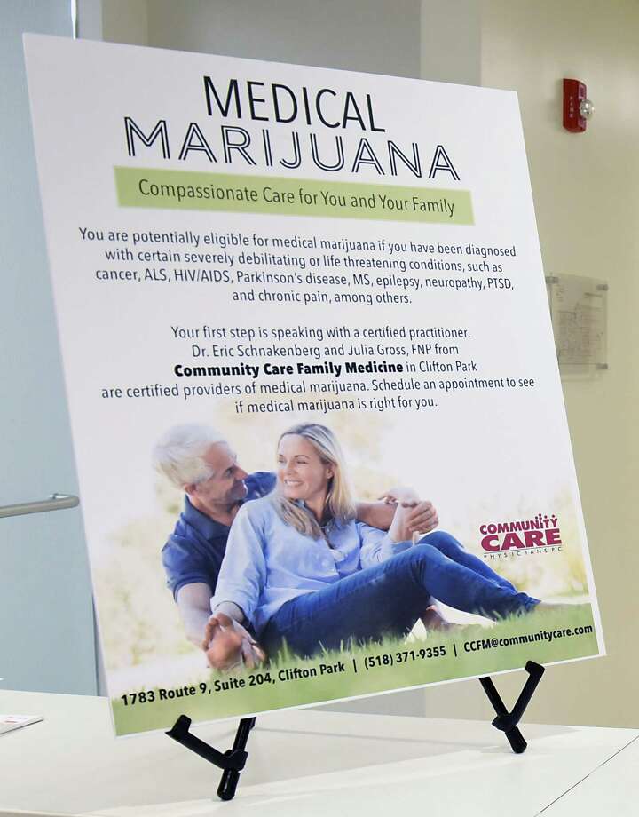 A sign is seen at the office of Dr. Eric Schnakenberg, a physician at Community Care Family Medicine in Clifton Park, and his colleague, Julia Gross, a nurse practitioner on Thursday, June 8, 2018 in Clifton Park, N.Y. They are among a small but growing number of practitioners in New York who have found success weaning patients off of opioids and onto medical marijuana for their chronic pain. (Lori Van Buren/Times Union) Photo: Lori Van Buren / 20044028A